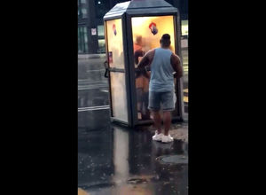 Brit duo pounds in telephone booth in