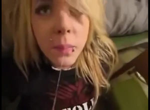 Ash-blonde punk young lady gets intense